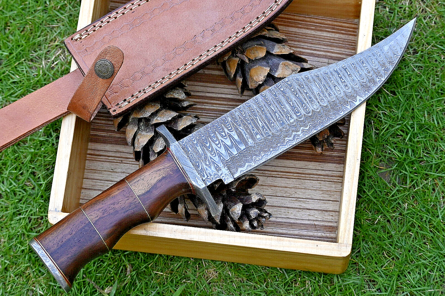 Wilderness Guardian: Hunting Bowie Knife with Damascus Steel Blade, Rosewood Handle, Brass Spacers, Damascus Guard, and Leather Sheath