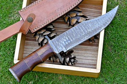 Wilderness Guardian: Hunting Bowie Knife with Damascus Steel Blade, Rosewood Handle, Brass Spacers, Damascus Guard, and Leather Sheath